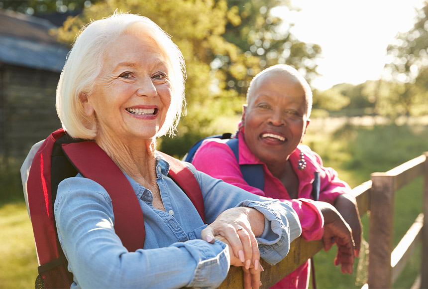 portrait of two senior friends stopped on a break while hiking retirement strategies bellevue wa
